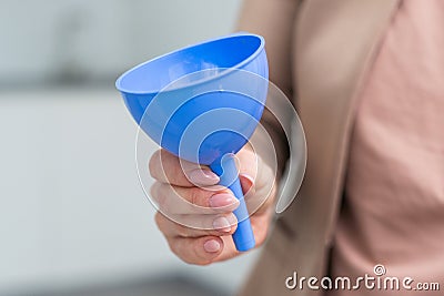 hand holds a funnel on white background Stock Photo