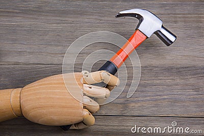 Hand holds a hammer Stock Photo