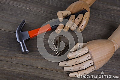 Hand holds a hammer Stock Photo