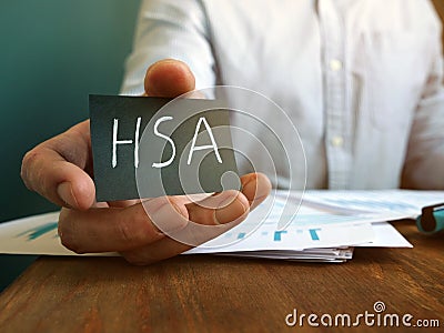 Hand holds Health Savings Accounts HSA inscription Stock Photo