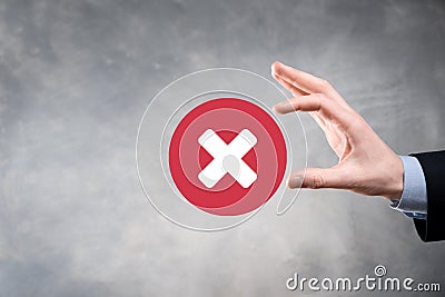 Hand holds icon,cancellation symbol,cancel icon.Cross mark flat red icon.round X mark.cancel button.Wrong.cross mark rejection. Stock Photo