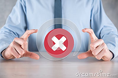 Hand holds icon,cancellation symbol,cancel icon.Cross mark flat red icon.round X mark.cancel button.Wrong.cross mark rejection. Stock Photo