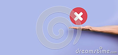 Hand holds icon,cancellation symbol,cancel icon.Cross mark flat red icon.round X mark.cancel button.Wrong.cross mark rejection. Stock Photo