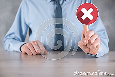 Hand holds icon,cancellation symbol,cancel icon.Cross mark flat red icon.round X mark.cancel button.Wrong.cross mark rejection. Stock Photo