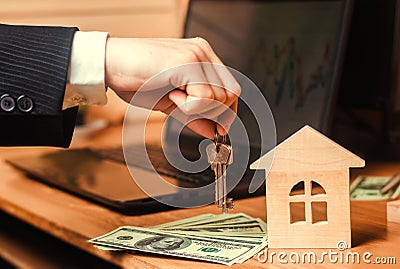 The hand holds the keys to the house. concept of real estate. sale or rental of housing, apartment rental. realtor. mortgage conce Stock Photo