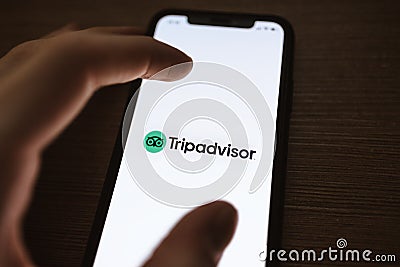 TripAdvisor app logo on the smartphone screen Editorial Stock Photo