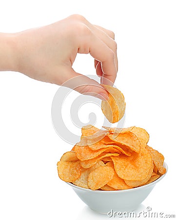 Hand holds a potato chip Stock Photo