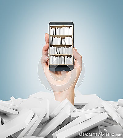 A hand holds a smartphone with a book shelf on the screen. A heap of books with white covers. A concept of education and technolog Stock Photo