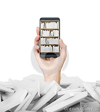 A hand holds a smartphone with a book shelf on the screen. A heap of books with white covers. Stock Photo