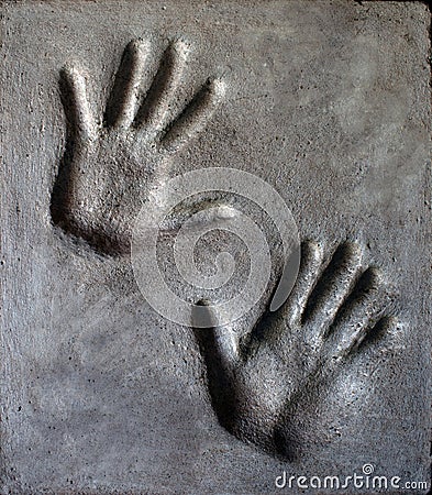 Hand imprint in mortar. Stock Photo