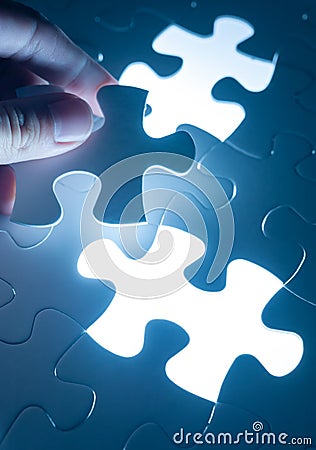 Hand insert jigsaw, conceptual image of business strategy, decision making concept Stock Photo