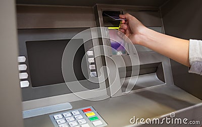 Hand inserting a credit card Stock Photo