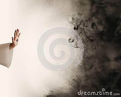 Hand of Jesus stopping darkness Stock Photo