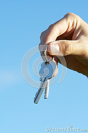 Hand keys on the skies Stock Photo