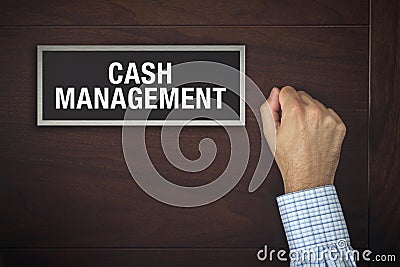Hand is knocking on Cash Management door Stock Photo
