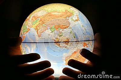 Hand on light globe Stock Photo