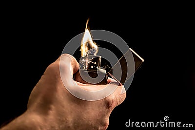 Hand and a lighter Stock Photo