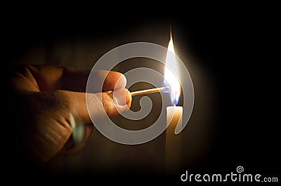 Hand lighting candle concept Stock Photo