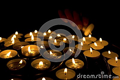 Hand lighting candles Stock Photo