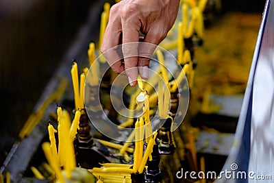 Hand lighting candles Stock Photo