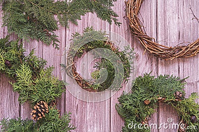 Hand made christmas wreathes on wooden background top view Stock Photo