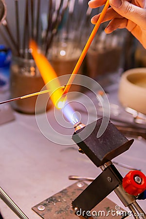 Hand-made lampworking in a glass-blowing workshop Stock Photo