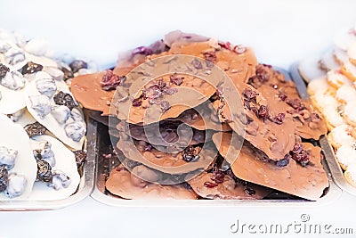 Hand made sweets dark chocolate and white close up on isolated background Stock Photo
