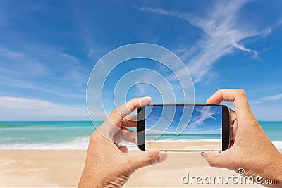 Hand male asian holding Smartphone taking picture of Landscape v Stock Photo