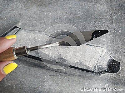hand man holding tool artist palette knife paint tube drawing oil painting gray black white Stock Photo