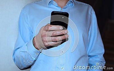 Hand of man using smartphone Stock Photo