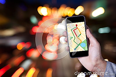 Hand of man using map on smartphone application with bokeh. Stock Photo