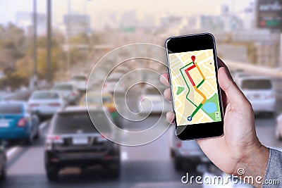 Hand of man using map on smartphone application with traffic jam Stock Photo