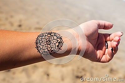 Hand with mandala pattern tattoo henna mehendi Stock Photo