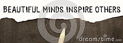 Hand with marker writing the word Beautiful Minds Inspire Others Stock Photo