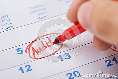 Hand Marking Audit On Calendar Stock Photo