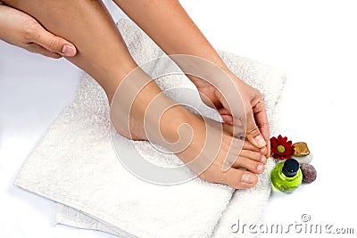 Hand massaging toes Stock Photo