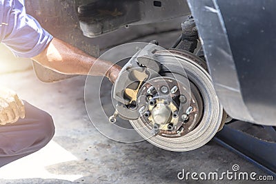 Hand mechanic hold the break caliper for repair brake disc Stock Photo