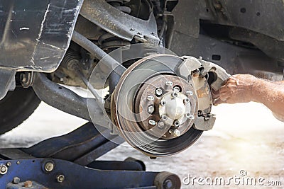 Hand mechanic repair brake disc Stock Photo