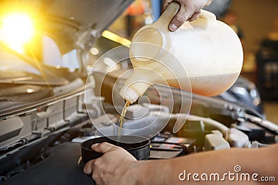 Hand mechanic in repairing car,Change the Oil Stock Photo