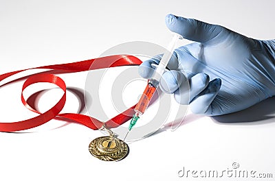 A hand in medical glove stabs a gold medal with popular red steroid in syringe on a white background Stock Photo