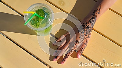 Hand with mehendi on black background muslim, bodyart, finger, cosmetic, embellish, girl Stock Photo