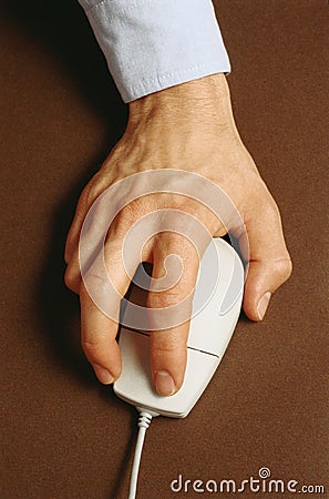 Hand with mouse pointing device Stock Photo