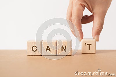 Hand moving text , changed CAN'T to CAN. For positive mindset, attitude thinking, yes you can, business success, motivati Stock Photo