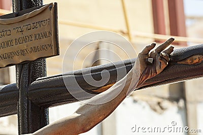 Hand nailed to the cross of the sculpture of the crucified Chris Stock Photo