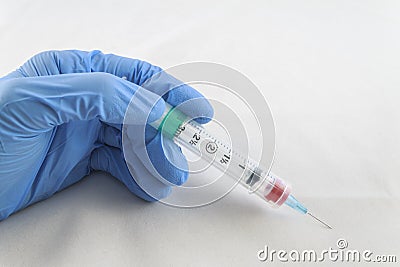 Hand and Needle Stock Photo