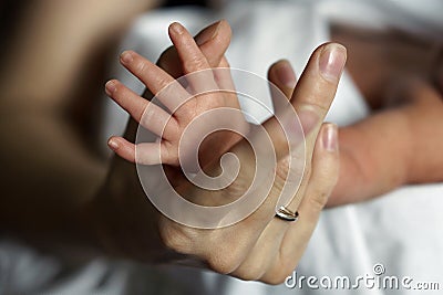Hand of the newborn in the hand of a woman Stock Photo