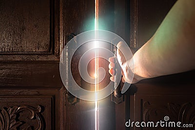 Hand open door light. Stock Photo