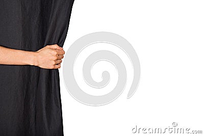 Hand opening black curtain Stock Photo