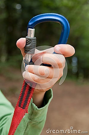 Hand opening carabiner mountain Stock Photo