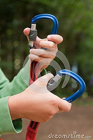 Hand opening carabiner mountain Stock Photo